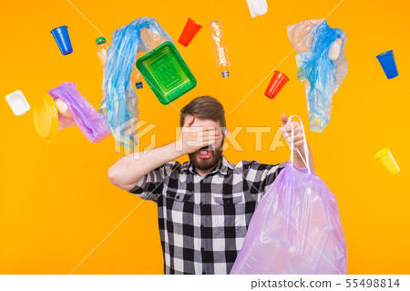 Environmental pollution, plastic recycling problem and ecology problem concept - sad man holding Environmental pollution, plastic recycling problem and ecology problem concept - sad man holding 55498814