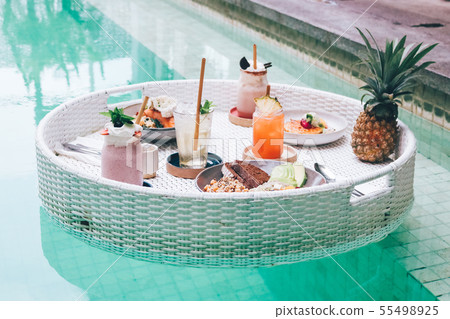 Breakfast on floating table in the pool. Healthy 55498925