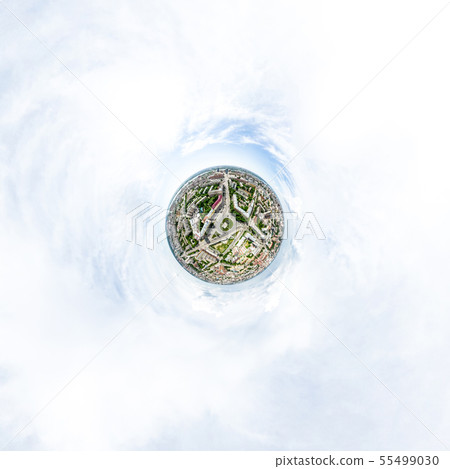 Aerial city view with crossroads and roads, houses, buildings, parks and parking lots. Sunny summer 55499030