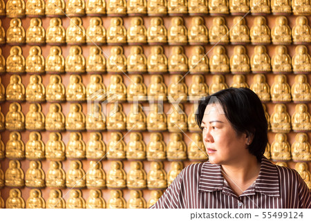 Woman at Wat Boromracha Kanchanapisek Anusorn Woman at Wat Boromracha Kanchanapisek Anusorn 55499124