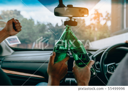 Two male friends are celebrating in the car while Two male friends are celebrating in the car while 55499996