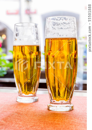 Two glasses of fresh beer on the table 55501888