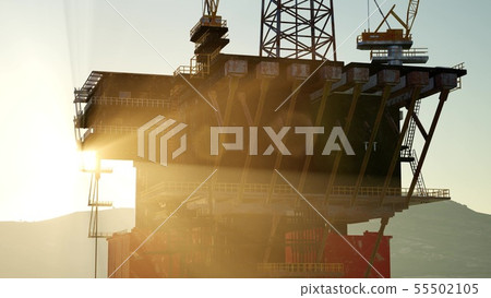 An offshore oil platform at sunset light 55502105