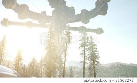 UFO hovering over a forest at sunset with light 55502272