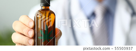 Male doctor hold bottle with marijuana oil Male doctor hold bottle with marijuana oil 55503937