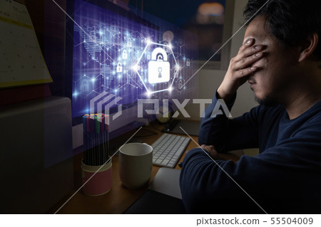 Portrait of Asia Businessman sitting and working hard via Security key lock icon digital hologram display over the world map and Hexagon shape on the computer screen in work place with serious action 55504009