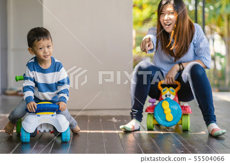 Asian single mom with son are playing with car toy together when living in modern house for Self learning or home school, Family and single mom concept, selective focus 55504066