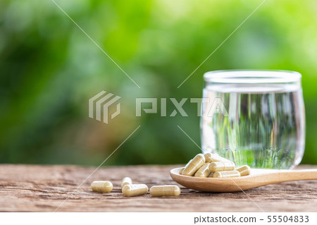Capsule of herb Indian Senna or Tinnevelly Senna on wooden table 55504833