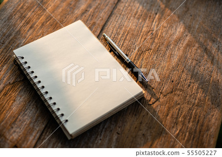 Top view of white book on old wooden plank background Top view of white book on old wooden plank background 55505227