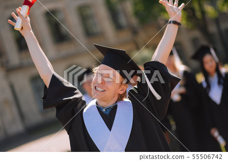 Happy boy raising his hands in the air. 55506742