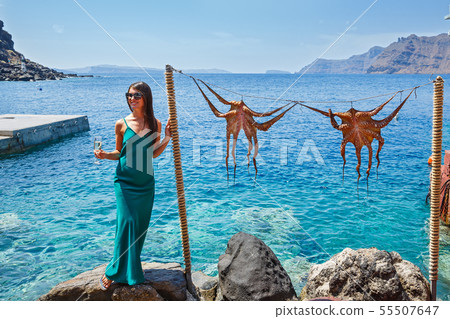 Young woman ion the background of the sea Young woman ion the background of the sea 55507647