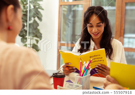Delighted brunette student learning Japanese with pleasure Delighted brunette student learning Japanese with pleasure 55507918
