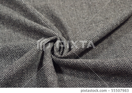 Draped herringbone tweed wool fabric texture Draped herringbone tweed wool fabric texture 55507983
