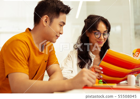 Kind brunette male person sitting in semi position Kind brunette male person sitting in semi position 55508045