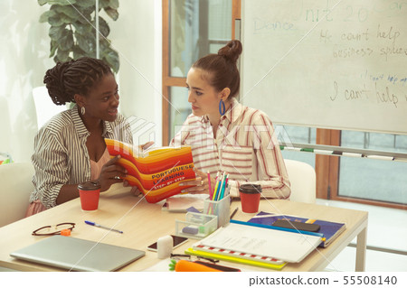 Attentive young female person looking at her teacher Attentive young female person looking at her teacher 55508140