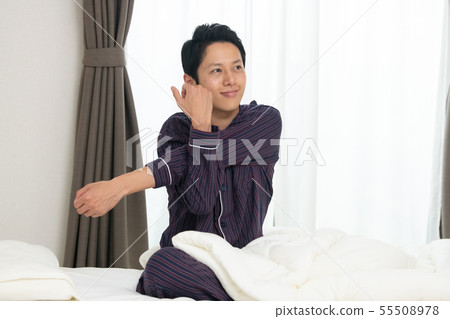 Getting up stretching japanese man morning smile Getting up stretching japanese man morning smile 55508978