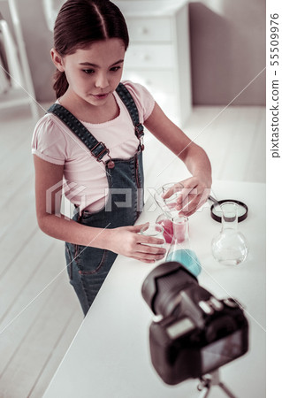 Pleasant smart girl explaining what she is doing Pleasant smart girl explaining what she is doing 55509976