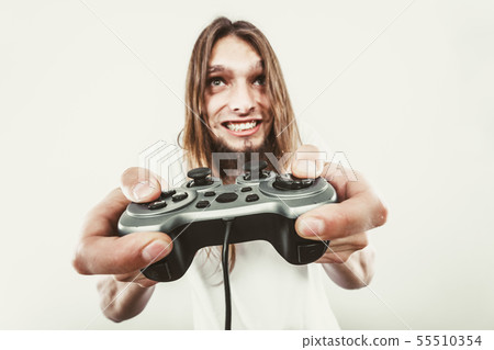 Happy man playing games Happy man playing games 55510354