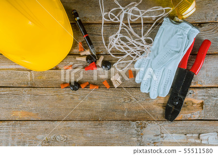 Electrician technician at work prepares the tools Electrician technician at work prepares the tools 55511580