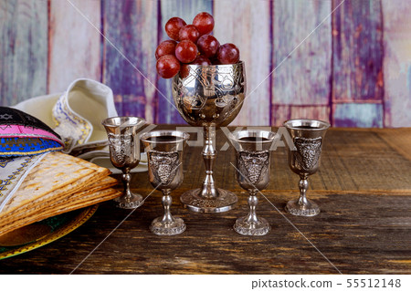 Passover matzoh jewish holiday bread, four glasses 55512148