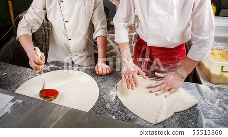 Preparation of dough for pizza. Cooking pizza in the cafe. Preparation of dough for pizza. Cooking pizza in the cafe. 55513860
