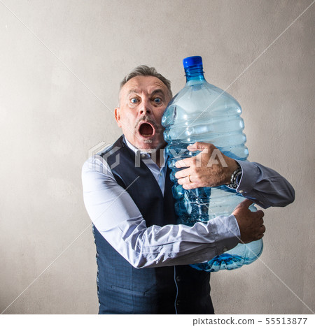 man  with a giant water bottle 55513877