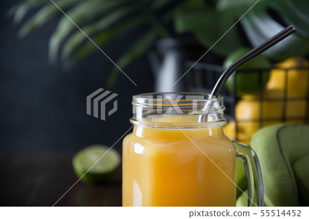 Fresh summer fruits juice with lemon, lime on dark Fresh summer fruits juice with lemon, lime on dark 55514452