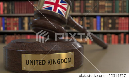 Flag of Great Britain on falling judges gavel in court. National justice or jurisdiction related 55514727