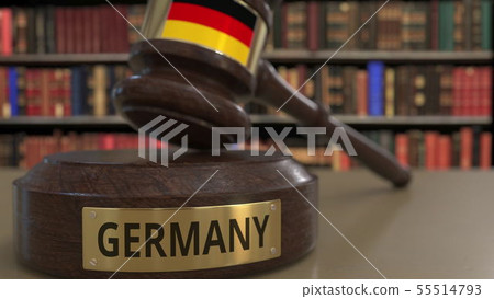 Flag of Gemany on falling judges gavel in court. National justice or jurisdiction related conceptual 55514793
