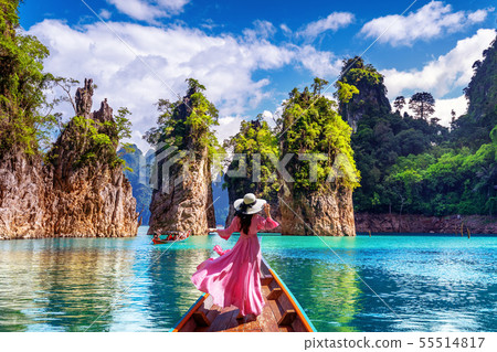 Beautiful girl standing on the boat  55514817