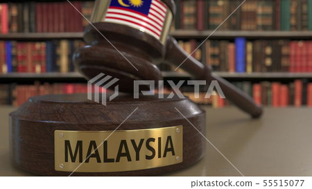 Flag of Malaysia on falling judges gavel in court. National justice or jurisdiction related Flag of Malaysia on falling judges gavel in court. National justice or jurisdiction related 55515077