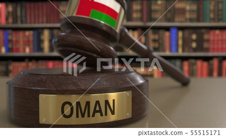 Flag of Oman on judges gavel in court. National justice or jurisdiction related conceptual 3D 55515171