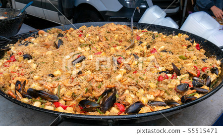 large dish of paella on the market 55515471