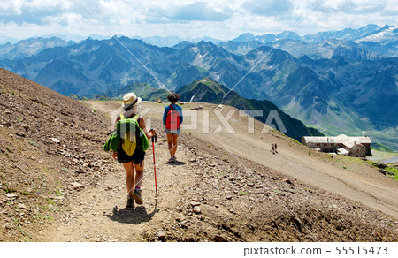 two women hiker on  mountain trail in the Pyrenees 55515473