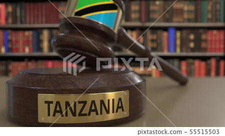 Flag of Tanzania on judges gavel in court. National justice or jurisdiction related conceptual 3D Flag of Tanzania on judges gavel in court. National justice or jurisdiction related conceptual 3D 55515503