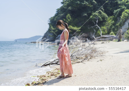 A woman relaxing at the sea A woman relaxing at the sea 55516417
