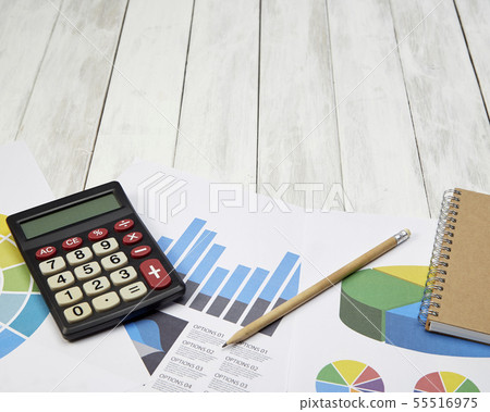 High Angle View Calculator On Documents On Table 55516975