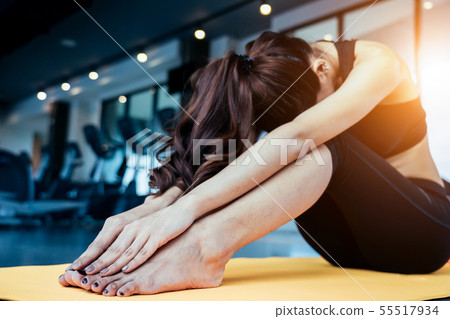 Asian woman exercising and workout in the fitness Asian woman exercising and workout in the fitness 55517934