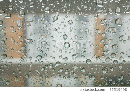 Water droplet pattern on the window of an apartment on a rainy day 55519498
