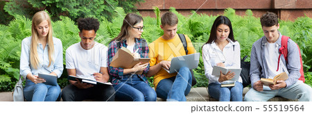 Preparing for lecture. Teens sitting in university campus 55519564