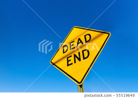 Dead end road sign on a blue clear sky day. Dead end road sign on a blue clear sky day. 55519649