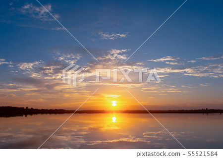 Sunset reflection lagoon. beautiful sunset behind Sunset reflection lagoon. beautiful sunset behind 55521584