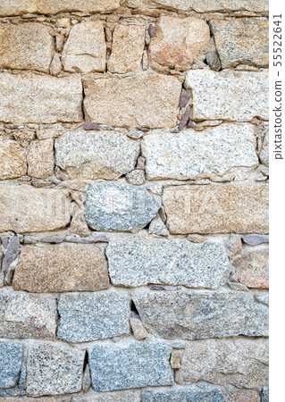 Texture of an irregular stone wall. Background. Texture of an irregular stone wall. Background. 55522641