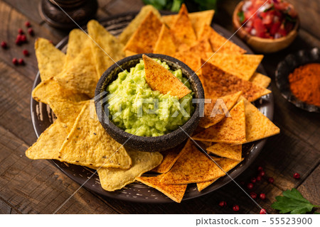 Guacamole, nachos and tortilla chips 55523900