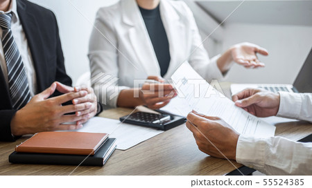 Employer or recruiter holding reading a resume 55524385