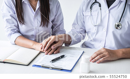 Image of doctor holding patient's hand to 55524750