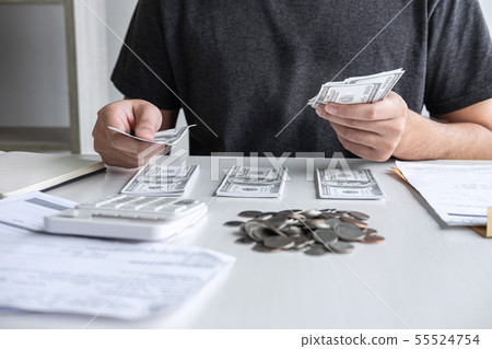 Images of stacking coin pile and Husband using Images of stacking coin pile and Husband using 55524754