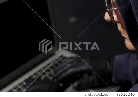 Hacker on a laptop Hacker on a laptop 55525210