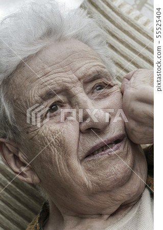 Closeup portrait of thoughtful senior woman Closeup portrait of thoughtful senior woman 55525404