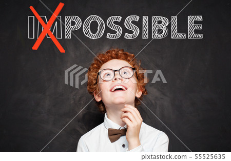 Cutte happy kid in glasses looking at possible 55525635